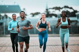 Sculpting Sleek Arms: The Essential Role of Cardio in Toning Without Bulking Up 3 image of people running to incorporate cardio Wentworth exercise into their life to help tone arms and body.