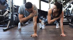 Image of man and woman doing Cardio Wentworth to tone their arms. 